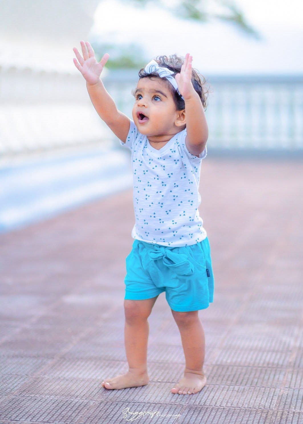 Baby portrait photoshoot reaching upward in Colombo, Sri Lanka