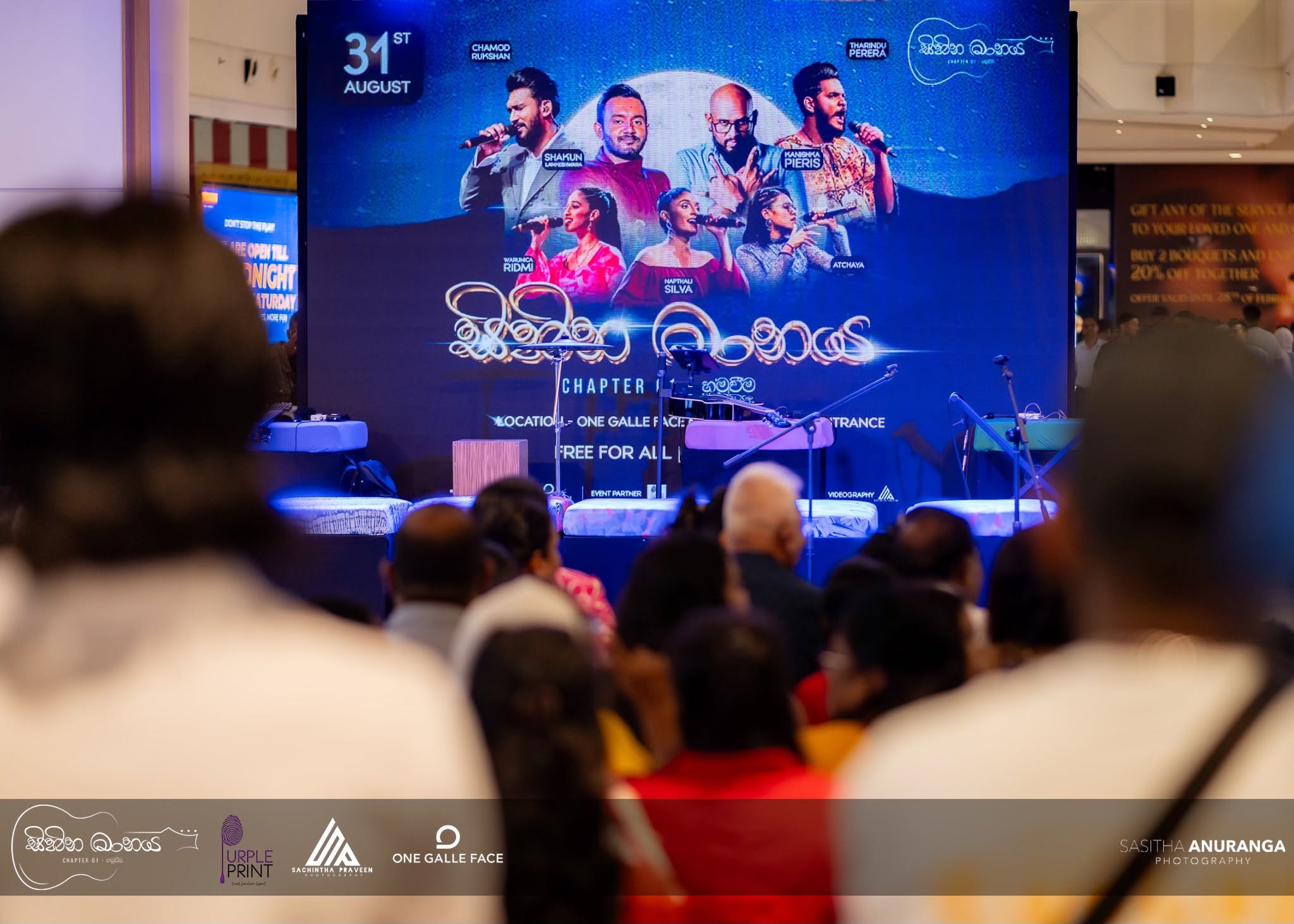 Event photography of the Sihina Maanaya stage backdrop and crowd at One Galle Face mall