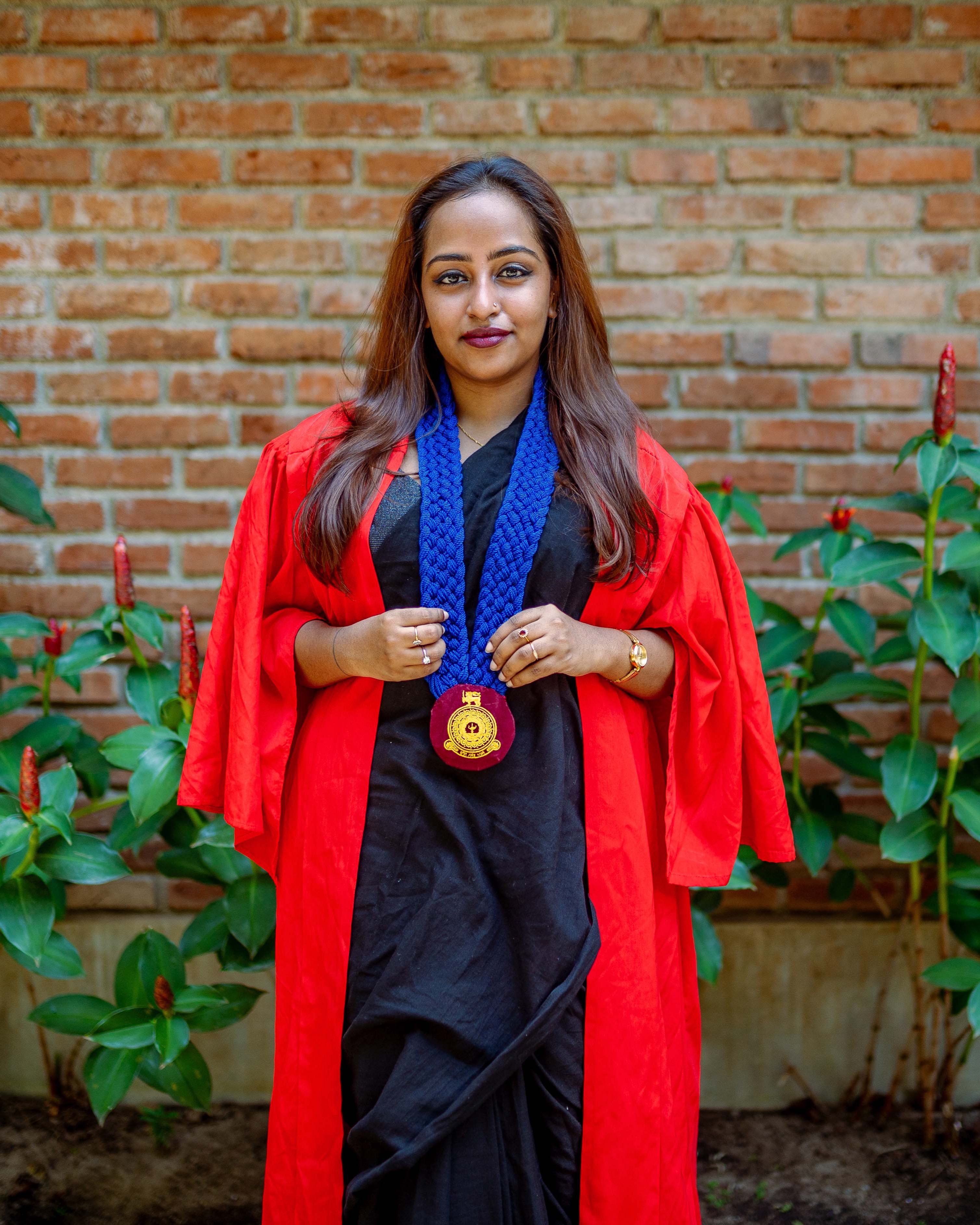 Graduation portrait photography against a brick wall in Colombo, Sri Lanka